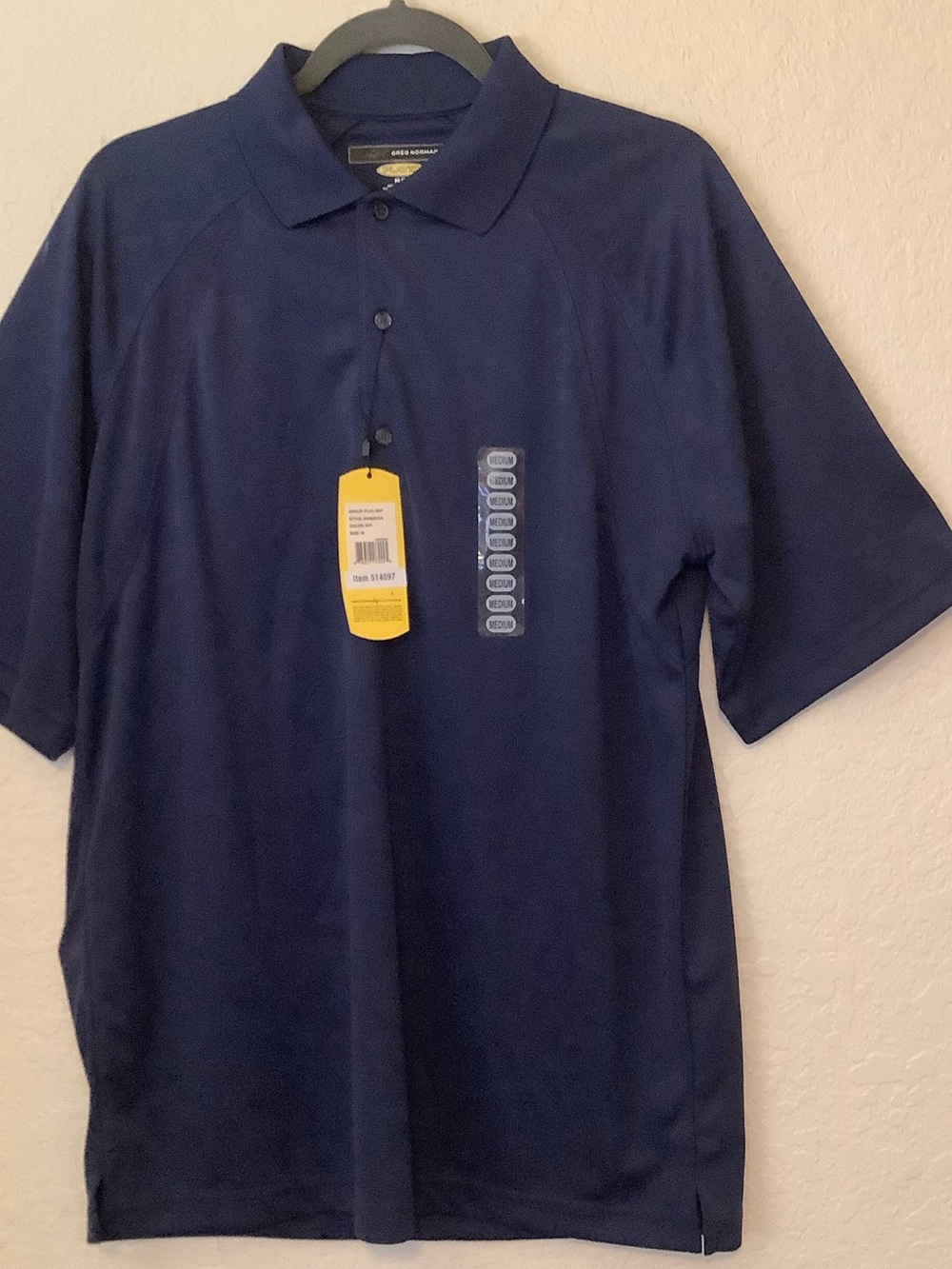 Two size medium polo shirts. Greg Norman Blue NWT Donald Ross Peach   Striped